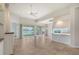 Open living room featuring tile floors and sliding glass doors at 5759 Benevento Dr, Sarasota, FL 34238
