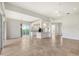 Open living area with tile floors and access to backyard at 5759 Benevento Dr, Sarasota, FL 34238