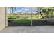 Relaxing screened patio with lake view at 5759 Benevento Dr, Sarasota, FL 34238