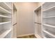 Spacious walk-in closet with ample shelving and hanging space at 5759 Benevento Dr, Sarasota, FL 34238