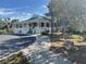 Community clubhouse with welcoming porch and landscaping at 6723 Tailfeather Way, Bradenton, FL 34203