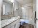 Updated bathroom with granite countertop, white cabinets, and a shower/tub combo at 707 Sorrento Inlt # 707, Nokomis, FL 34275
