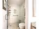 Walk-in shower with modern tile and built-in shelving at 707 Sorrento Inlt # 707, Nokomis, FL 34275
