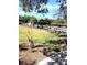 Community boat dock and lush landscaping at 707 Sorrento Inlt # 707, Nokomis, FL 34275