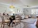 Bright dining area with glass-top table and four chairs at 707 Sorrento Inlt # 707, Nokomis, FL 34275