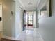 Light and airy entryway with tile flooring and a view to the backyard at 707 Sorrento Inlt # 707, Nokomis, FL 34275