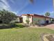 Front view of the house, well maintained landscaping at 707 Sorrento Inlt # 707, Nokomis, FL 34275