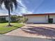 House exterior with a driveway and landscaping at 707 Sorrento Inlt # 707, Nokomis, FL 34275