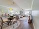 Bright living room features stylish furniture, hardwood floors, and a dining area at 707 Sorrento Inlt # 707, Nokomis, FL 34275