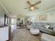 Open living space with sectional sofa and dining area at 707 Sorrento Inlt # 707, Nokomis, FL 34275
