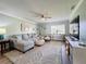 Spacious living room with sectional sofa and large TV at 707 Sorrento Inlt # 707, Nokomis, FL 34275
