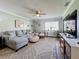 Relaxing living room, featuring a sectional sofa and large window at 707 Sorrento Inlt # 707, Nokomis, FL 34275