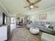 Open living room with sectional sofa and view into dining and kitchen area at 707 Sorrento Inlt # 707, Nokomis, FL 34275