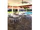 Relaxing pool area with covered seating and tables at 707 Sorrento Inlt # 707, Nokomis, FL 34275