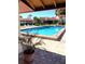 Refreshing community swimming pool with lounge chairs at 707 Sorrento Inlt # 707, Nokomis, FL 34275