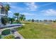 Landscaped backyard with pond and golf course views at 741 Fairway Ridge Ct, Sun City Center, FL 33573