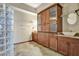 Bathroom boasts a glass block shower, updated vanity, and ample storage at 741 Fairway Ridge Ct, Sun City Center, FL 33573