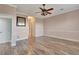 Primary bedroom with hardwood floors and walk-in closet at 741 Fairway Ridge Ct, Sun City Center, FL 33573