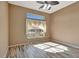 Spacious bedroom with wood-look floors and large window at 741 Fairway Ridge Ct, Sun City Center, FL 33573