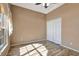 Bright bedroom with wood-look floors and double doors at 741 Fairway Ridge Ct, Sun City Center, FL 33573