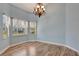 Dining room with hardwood floors and bay window at 741 Fairway Ridge Ct, Sun City Center, FL 33573