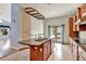 Kitchen features a large granite island and wood cabinets at 741 Fairway Ridge Ct, Sun City Center, FL 33573