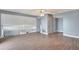 Second living area with wood-look floors and ceiling fan at 741 Fairway Ridge Ct, Sun City Center, FL 33573