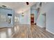 Open living and dining area with hardwood floors and kitchen view at 741 Fairway Ridge Ct, Sun City Center, FL 33573