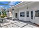 White screened porch with access to interior at 741 Fairway Ridge Ct, Sun City Center, FL 33573