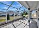 Spacious screened porch with concrete flooring at 741 Fairway Ridge Ct, Sun City Center, FL 33573