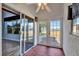 Sunroom with tile floors, sliding glass doors and lake view at 741 Fairway Ridge Ct, Sun City Center, FL 33573