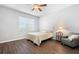Bright bedroom with wood floors and ceiling fan at 8003 Limestone Ln # 15-103, Sarasota, FL 34233