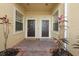 Shared entryway with two individual condo doors and a welcome mat at 8003 Limestone Ln # 15-103, Sarasota, FL 34233