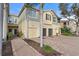 Two-story townhome with attached garages and a brick walkway at 8003 Limestone Ln # 15-103, Sarasota, FL 34233