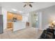Kitchen with wood cabinets, stainless steel appliances, and an island at 8003 Limestone Ln # 15-103, Sarasota, FL 34233