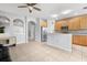 Open kitchen with stainless steel appliances and wood cabinets at 8003 Limestone Ln # 15-103, Sarasota, FL 34233