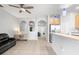 Open kitchen with island, stainless steel appliances, and wood cabinets at 8003 Limestone Ln # 15-103, Sarasota, FL 34233