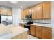 Kitchen features stainless steel appliances and wood cabinets at 8003 Limestone Ln # 15-103, Sarasota, FL 34233