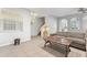 Living area features a sectional sofa and a rustic coffee table at 8003 Limestone Ln # 15-103, Sarasota, FL 34233