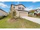 Two-story house with a two-car garage and landscaped yard at 9011 Waxwing Way, Parrish, FL 34219