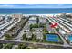 Aerial view of the property, tennis courts, and beach access at 1130 W Peppertree Ln # 118, Sarasota, FL 34242