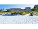 Beach access with chairs and umbrellas available for residents at 1130 W Peppertree Ln # 118, Sarasota, FL 34242