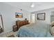 King-size bed, dresser, and TV in this bright bedroom at 1130 W Peppertree Ln # 118, Sarasota, FL 34242