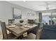 Charming dining area with a square table set for four guests at 1130 W Peppertree Ln # 118, Sarasota, FL 34242