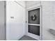 Condo entrance with a screen door and a charming wreath at 1130 W Peppertree Ln # 118, Sarasota, FL 34242