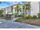 Building exterior showing walkway, landscaping, and parking at 1130 W Peppertree Ln # 118, Sarasota, FL 34242