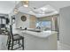 Modern kitchen with white cabinets, quartz countertops, and stainless steel appliances at 1130 W Peppertree Ln # 118, Sarasota, FL 34242