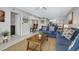 Bright living room featuring comfortable seating and stylish decor at 1130 W Peppertree Ln # 118, Sarasota, FL 34242