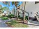 Condo entrance with lush landscaping and walkway at 147 Pinehurst Dr # 147, Bradenton, FL 34210