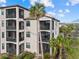 Condo building with screened balcony and beautiful landscaping at 16904 Vardon Ter # 301, Bradenton, FL 34211